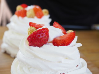 the chef decorates the dessert with fresh raspberries and strawberries. Anna Pavlovna's dessert