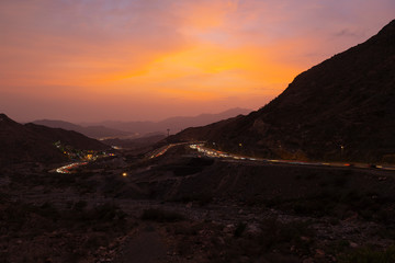 Fototapeta na wymiar Traffic light trails along the zig zag road in Al Hada, Taif region of Saudi Arabia