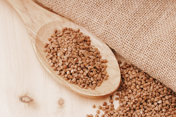 buckwheat (Fagopyrum esculentum) on the background of burlap, closeup , selective focus
