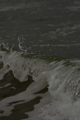 Small waves breaking off the West coast, New Zealand. 