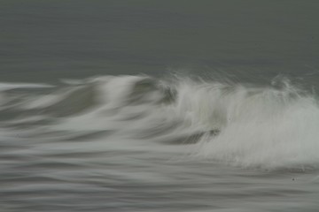 Small waves breaking off the West coast, New Zealand. 