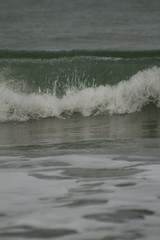 Small waves breaking off the West coast, New Zealand. 