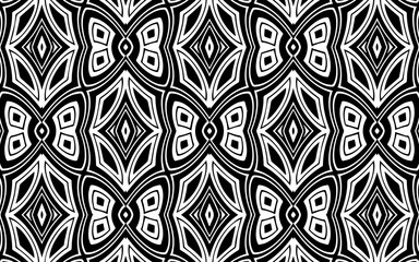 Black and white ethnic geometric exotic pattern background in African, Mexican, Native American and oriental print style with butterflies, geometric shapes and lines for design and decor decoration.