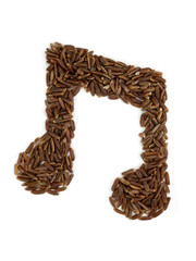 Note sign made from grains of brown rice on an isolated white background.