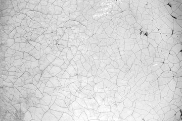 Old background with peeling paint cracks and chips. Light white orange texture.