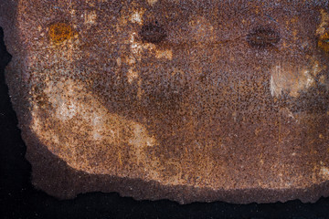 The old iron background is painted yellow, orange, purple, red in with rust and chips