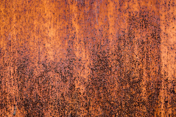 The old iron background is painted yellow, orange, purple, red in with rust and chips