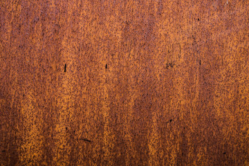 The old iron background is painted yellow, orange, purple, red in with rust and chips