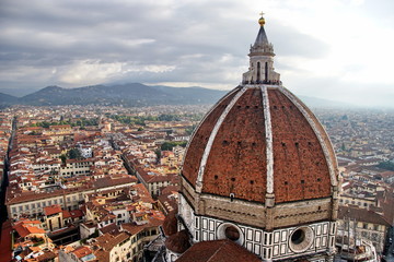 Fototapeta na wymiar Top view of Santa Maria del Fiore duomo church and Florence old city skyline in Italy