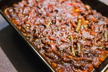 plant-based food, vegan lentils and beans stew with roasted vegetables in oven tray