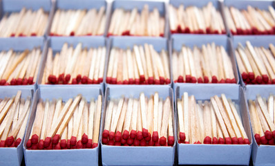 opened match boxes with red head  wooden matchsticks. Selective focus