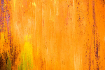 The old iron background is painted yellow, orange, purple, red in with rust and chips