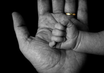 married man and baby hand