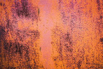 The old iron background is painted yellow, orange, purple, red in with rust and chips