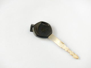 Motorcycle or car ignition key on white background.the key used for open and safety vehicle.