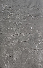 The surface of the object is Gray-black rough surface concrete