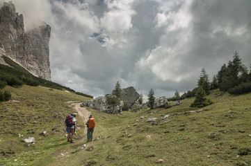 Fototapeta premium On trail from Coldai refuge via Coldai lake to Vazzoler refuge, along Civetta mountain range from north to south, stage 9 of Alta Via 1 classic long trek in the Dolomites, South Tirol, Italy.