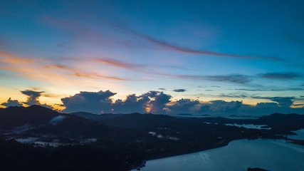 Aerial view of Kenyir Lake during blue hour sunrise.