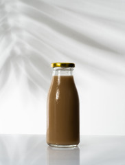 close up of coffee on a glass bottle product mockup