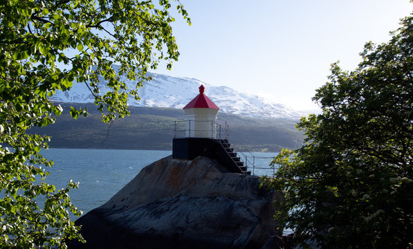 Snall lighthouse in Northern Norwegian fjord