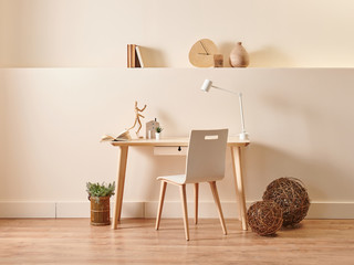 Modern and new style decorative wooden table and chair concept in the room, yellow background wall style with accessory book and lamp.