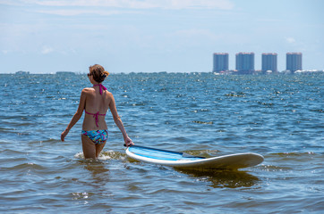 girl taking a break from paddleboarding