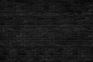 Fototapeta na wymiar Black brick building wall. Interior of a modern loft. Background for design and interview recording.