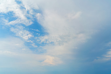 Naklejka na ściany i meble White clouds in the blue sky. Atmospheric natural background.
