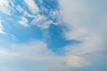 White clouds in the blue sky. Atmospheric natural background.
