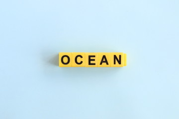 Ocean, lettering on a blue background in yellow letters