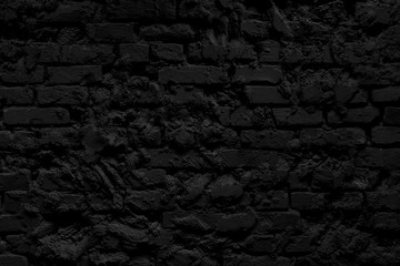 Black brick building wall. Interior of a modern loft. Background for design and interview recording.