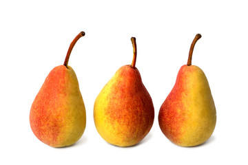 Three ripe juicy whole pear fruits isolated on a white background