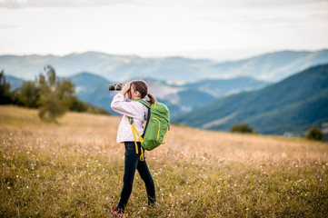 Little girl exploring with binoculars