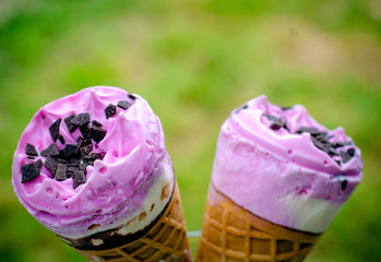 Two ice creams in a waffle cup