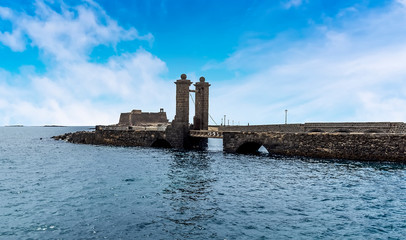 The view of the causeway to the Castle of Saunt Gabriel in Arrecife, Lanzarote on a sunny afternoon