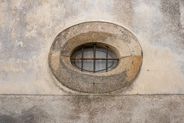 Old Small Stone Oval Window With Bars, Caminha, Portugal