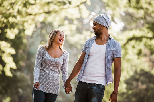 Portrait of happy mixed race couple in walking.