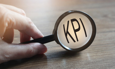 Magnifying glass searching KPI. Key performance indicator. Business concept
