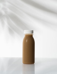 coffee product mockup on plastic bottle over white background