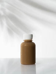 coffee product mockup on plastic bottle over white background
