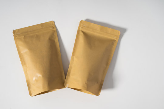 blank standing pouch mockup brown laying on white