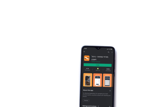 Lod, Israel - July 8, 2020: Bank Mizrahi Tefahot App Play Store Page On The Display Of A Black Mobile Smartphone Isolated On White Background. Top View Flat Lay With Copy Space.