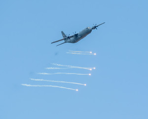 C130 Aircraft using counter-measure flares - Powered by Adobe