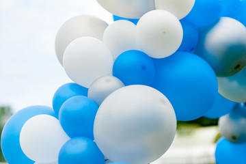 Bunch of blue and white balloons close up