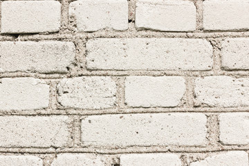 Old white decrepit brick wall