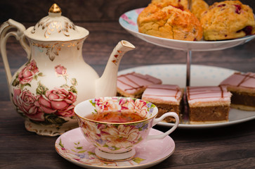 Cups of tea and cakes on the stand