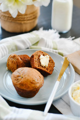 Fresh Homemade Muffins with Butter on Plate