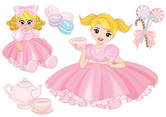 Toddler girl playing tea party with a doll