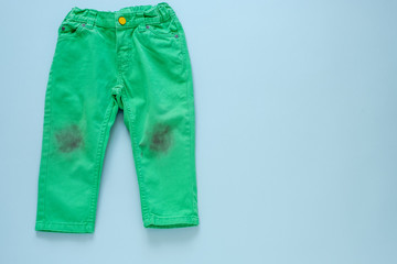 dirty children's green pants.isolated on gray background