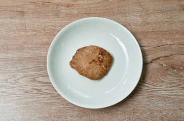 fried salty pork sirloin with garlicanf pepper on plate